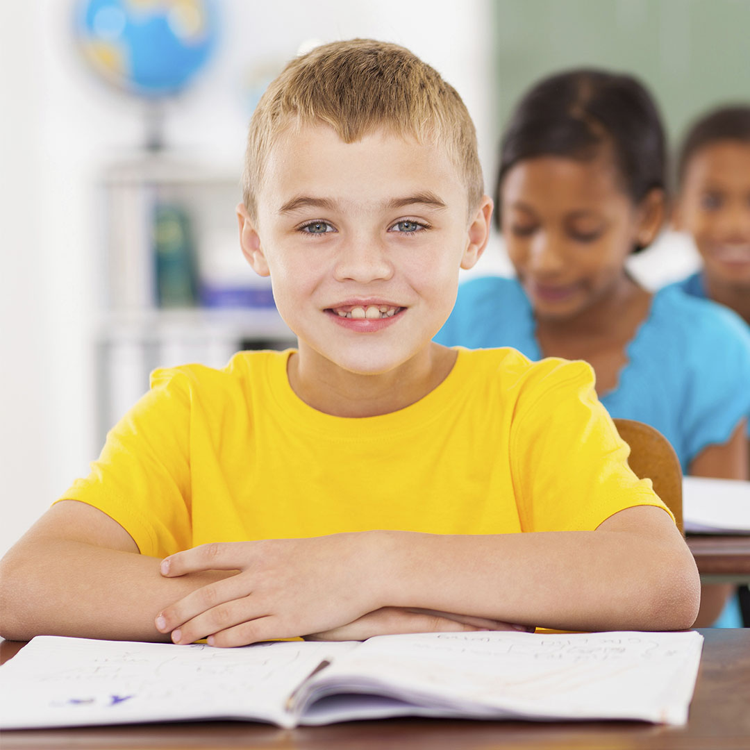 Elementary school students learning at desk