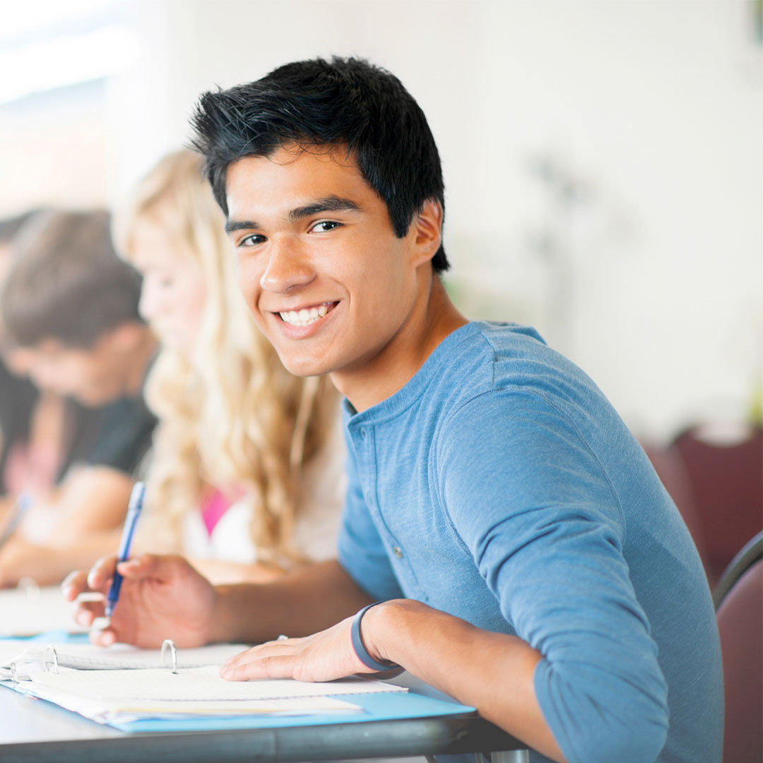 A student sits at his desk, preparing for his SAT or ACT test with our specialty tutoring service.